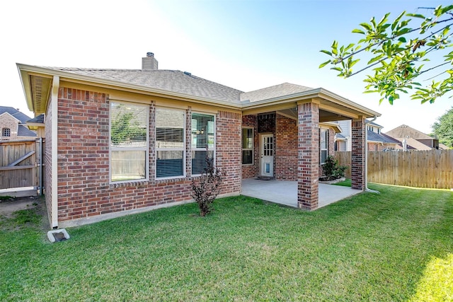 5232 Buffalo Gap Trl, Fort Worth, TX 76126 - rear view of house featuring a patio area, brick siding, a chimney, and a shingled roof