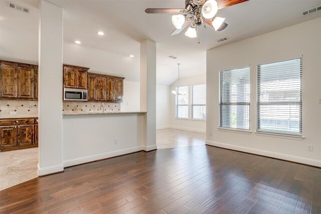 5232 Buffalo Gap Trl, Fort Worth, TX 76126 - unfurnished living room featuring ceiling fan, dark wood-style flooring, lofted ceiling, recessed lighting, and baseboards