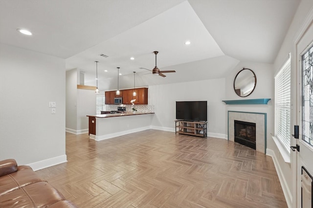 217 Arabian Rd, Waxahachie, TX 75165 - unfurnished living room featuring baseboards, recessed lighting, ceiling fan, a fireplace, and lofted ceiling
