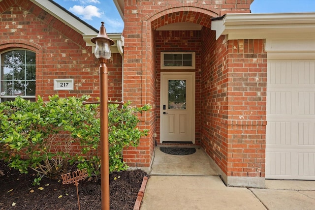217 Arabian Rd, Waxahachie, TX 75165 - doorway to property with brick siding and a garage