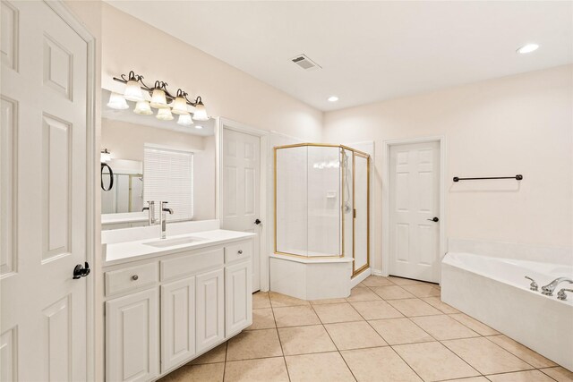 2001 Longfellow Ln, Flower Mound, TX 75028 - bathroom with tile patterned flooring, a shower stall, a bath, vanity, and recessed lighting