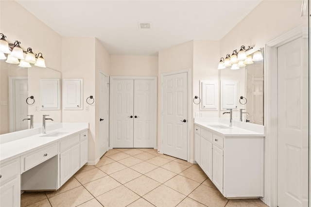 2001 Longfellow Ln, Flower Mound, TX 75028 - full bath featuring tile patterned floors, two vanities, and a closet