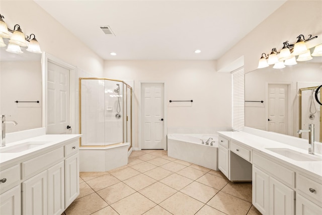 2001 Longfellow Ln, Flower Mound, TX 75028 - bathroom with a shower stall, a garden tub, tile patterned floors, two vanities, and recessed lighting