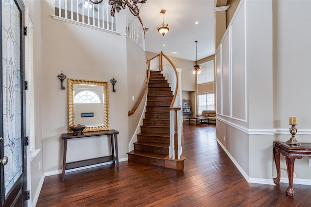 2001 Longfellow Ln, Flower Mound, TX 75028 - entrance foyer with plenty of natural light, stairway, wood finished floors, a towering ceiling, and baseboards