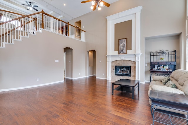 2001 Longfellow Ln, Flower Mound, TX 75028 - living room with ceiling fan, a high ceiling, wood finished floors, a premium fireplace, and baseboards