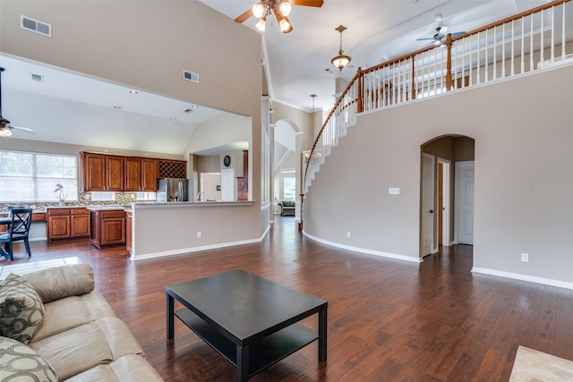 2001 Longfellow Ln, Flower Mound, TX 75028 - living room with a ceiling fan, arched walkways, high vaulted ceiling, and plenty of natural light