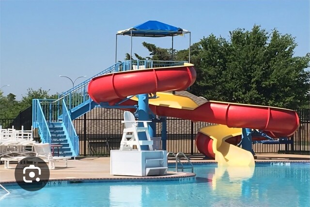 4820 Rum St, Fort Worth, TX 76244 - view of jungle gym with stairs, a water play area, and a community pool
