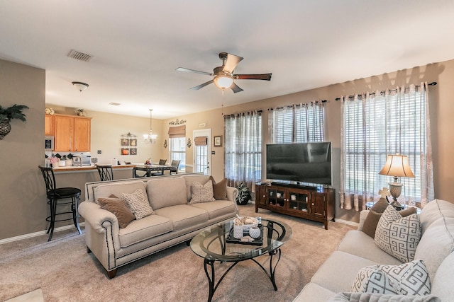 4820 Rum St, Fort Worth, TX 76244 - living room with ceiling fan, light carpet, a chandelier, and baseboards