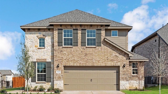 1700 Elle Ln, Aubrey, TX 76227 - view of front facade with stone siding, roof with shingles, concrete driveway, and brick siding