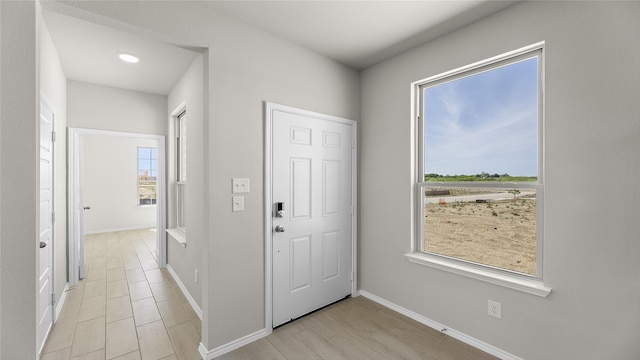 1700 Elle Ln, Aubrey, TX 76227 - entrance foyer featuring baseboards, recessed lighting, and light wood-style flooring