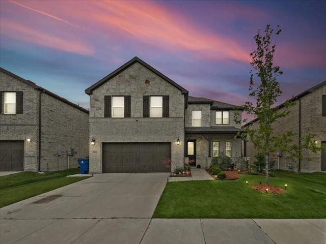 3605 Keechi Creek Dr, Celina, TX 75078 - traditional home with stone siding, a garage, concrete driveway, and a lawn