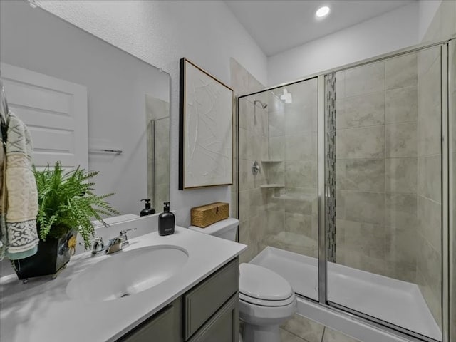 3605 Keechi Creek Dr, Celina, TX 75078 - full bathroom with a stall shower, toilet, vanity, tile patterned floors, and recessed lighting