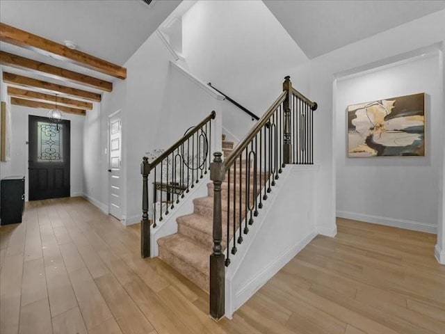 3605 Keechi Creek Dr, Celina, TX 75078 - foyer featuring light wood finished floors, baseboards, beam ceiling, and stairs