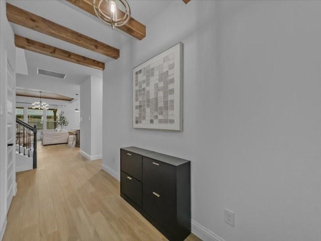 3605 Keechi Creek Dr, Celina, TX 75078 - hall featuring a chandelier, beamed ceiling, light wood-type flooring, baseboards, and stairs