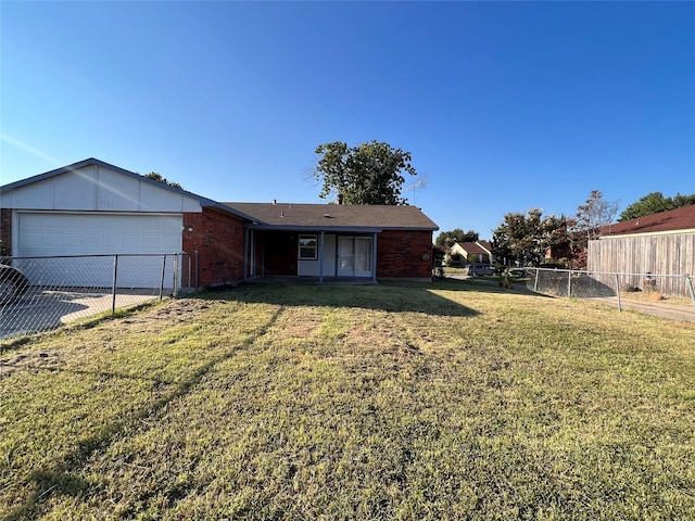 view of yard with a garage and concrete driveway