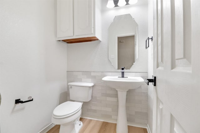 9103 Aristocrat Ln, Frisco, TX 75033 - half bathroom with toilet, wood finished floors, and tile walls