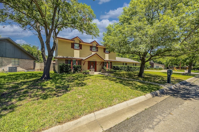 2011 Woodlawn St, Gainesville, TX 76240 - traditional home featuring brick siding, central AC, and covered porch