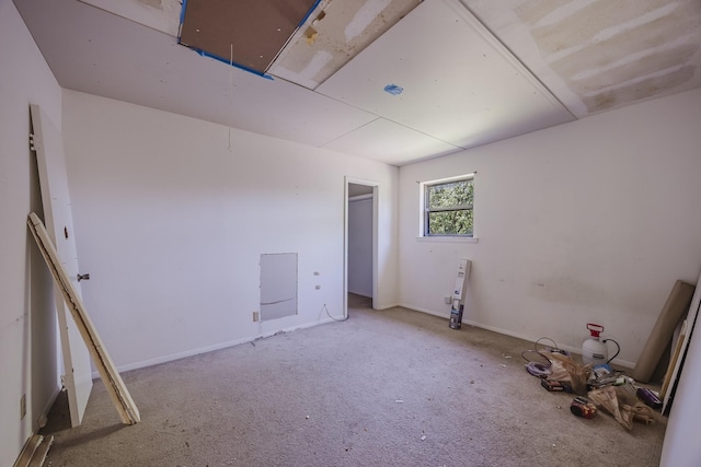 2011 Woodlawn St, Gainesville, TX 76240 - empty room featuring carpet and attic access