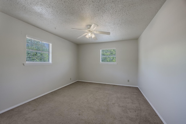 2011 Woodlawn St, Gainesville, TX 76240 - unfurnished room with carpet floors, a textured ceiling, ceiling fan, and baseboards