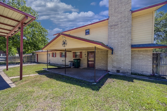 2011 Woodlawn St, Gainesville, TX 76240 - back of house featuring brick siding, a patio, a chimney, crawl space, and a garage