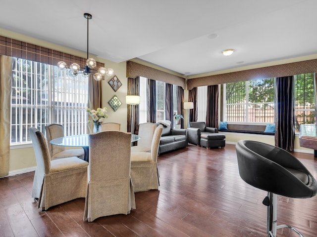 1217 Mandeville Dr, Murphy, TX 75094 - dining room with a chandelier, dark wood finished floors, and baseboards