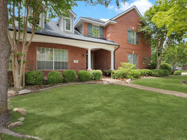 1217 Mandeville Dr, Murphy, TX 75094 - traditional home with brick siding and a front yard