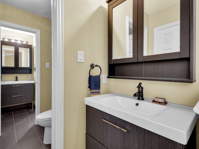 1217 Mandeville Dr, Murphy, TX 75094 - bathroom with tile patterned flooring, vanity, and toilet