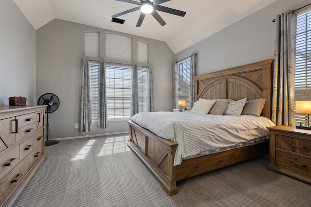 7601 Silverthorn, Rowlett, TX 75089 - bedroom featuring lofted ceiling, carpet floors, multiple windows, baseboards, and ceiling fan