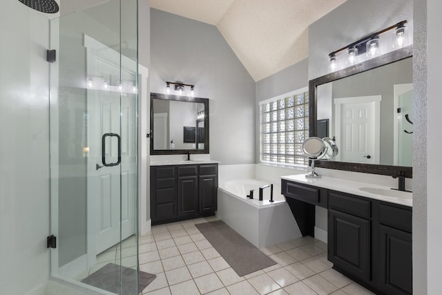 7601 Silverthorn, Rowlett, TX 75089 - full bathroom with vaulted ceiling, a shower stall, a garden tub, tile patterned flooring, and two vanities