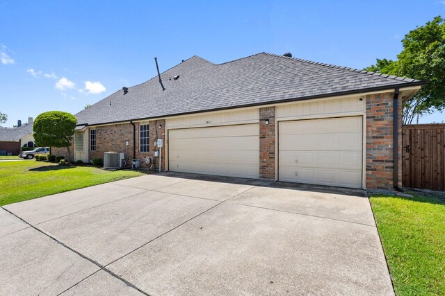 7601 Silverthorn, Rowlett, TX 75089 - view of side of home featuring central air condition unit, roof with shingles, concrete driveway, and brick siding
