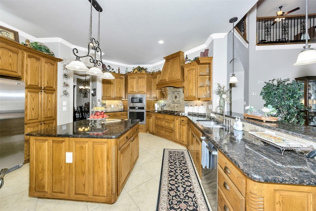 2401 Portwood Way, Fort Worth, TX 76179 - kitchen featuring appliances with stainless steel finishes, a sink, premium range hood, ornamental molding, and a center island