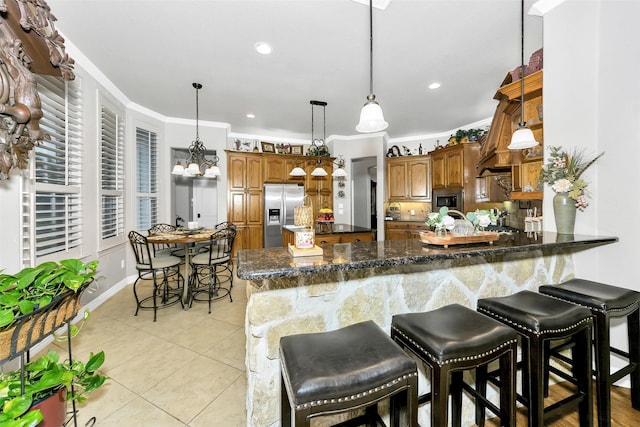 2401 Portwood Way, Fort Worth, TX 76179 - kitchen with stainless steel appliances, a peninsula, brown cabinets, light tile patterned floors, and crown molding