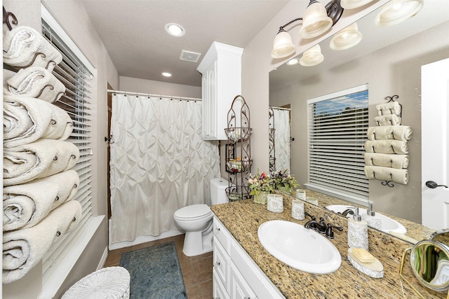 2401 Portwood Way, Fort Worth, TX 76179 - full bath with tile patterned flooring, toilet, vanity, a shower with curtain, and recessed lighting