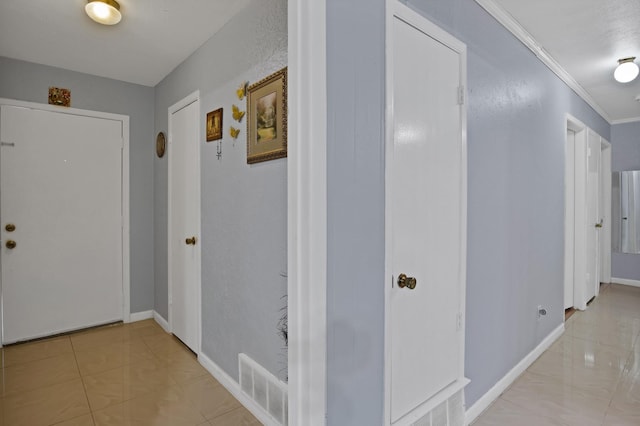 400 E Williamsburg Mnr, Arlington, TX 76014 - corridor with baseboards, crown molding, and light tile patterned floors