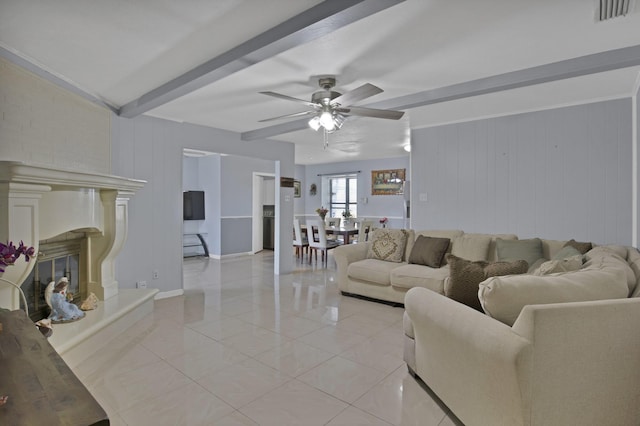 400 E Williamsburg Mnr, Arlington, TX 76014 - living room with beam ceiling, a ceiling fan, a premium fireplace, baseboards, and wood walls