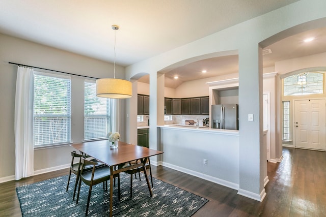 3101 Gilchrist Dr, Waco, TX 76655 - dining area with arched walkways, dark wood-type flooring, and recessed lighting