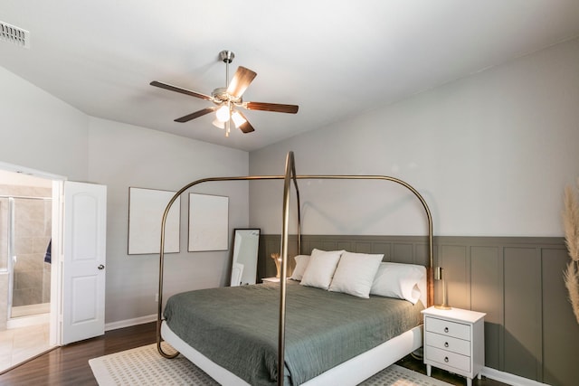 3101 Gilchrist Dr, Waco, TX 76655 - bedroom with dark wood-type flooring, ceiling fan, and connected bathroom