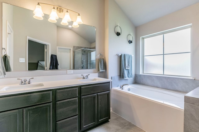 3101 Gilchrist Dr, Waco, TX 76655 - bathroom with a shower stall, double vanity, tile patterned floors, a garden tub, and vaulted ceiling