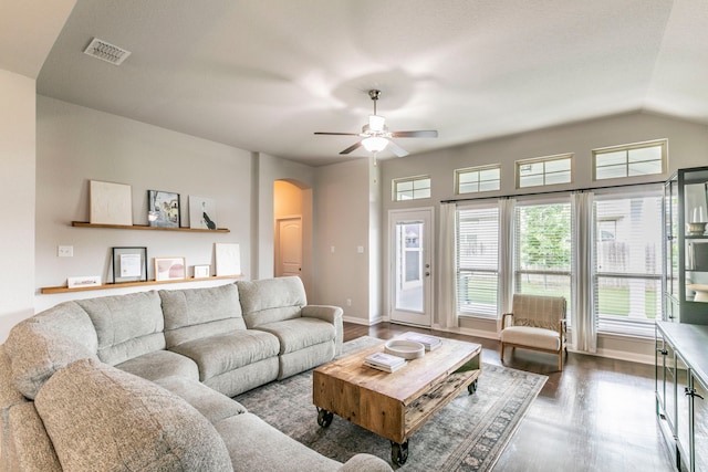 3101 Gilchrist Dr, Waco, TX 76655 - living room featuring arched walkways, dark wood finished floors, a ceiling fan, baseboards, and vaulted ceiling
