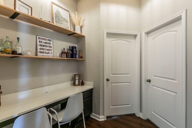 3101 Gilchrist Dr, Waco, TX 76655 - home office with dark wood-type flooring and a bar