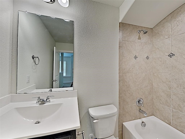 9105 Edenberry Ln, Fort Worth, TX 76179 - full bathroom featuring toilet, shower / tub combination, a textured wall, and vanity