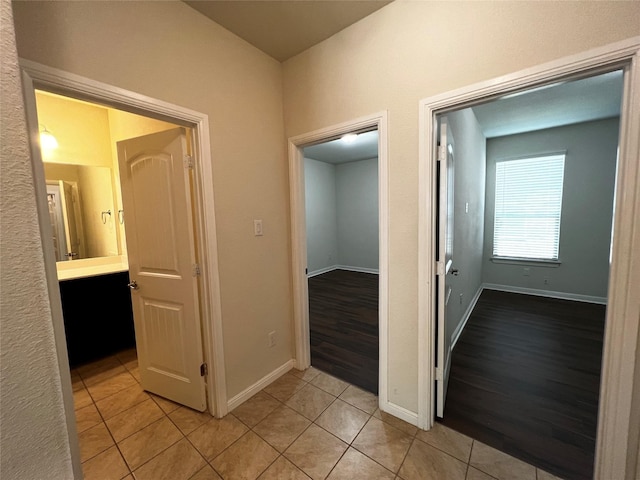 9105 Edenberry Ln, Fort Worth, TX 76179 - hallway featuring light tile patterned floors and baseboards