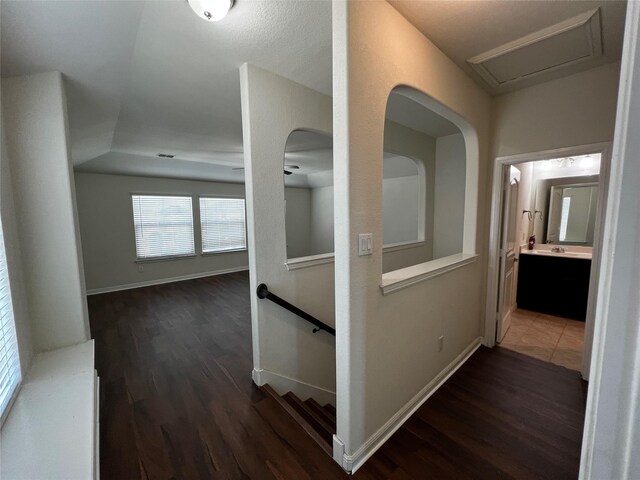 9105 Edenberry Ln, Fort Worth, TX 76179 - hallway featuring an upstairs landing, dark wood-type flooring, and baseboards