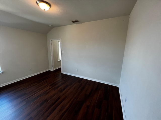 9105 Edenberry Ln, Fort Worth, TX 76179 - spare room featuring dark wood-style flooring, lofted ceiling, and baseboards