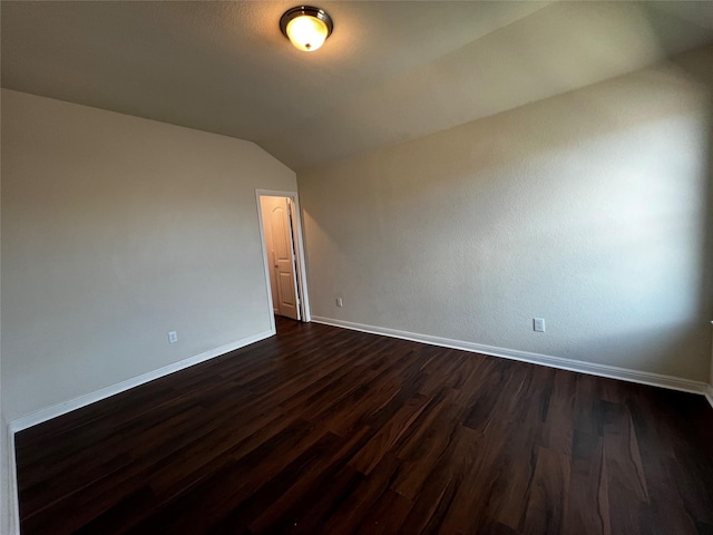 9105 Edenberry Ln, Fort Worth, TX 76179 - spare room featuring vaulted ceiling, dark wood-style floors, and baseboards