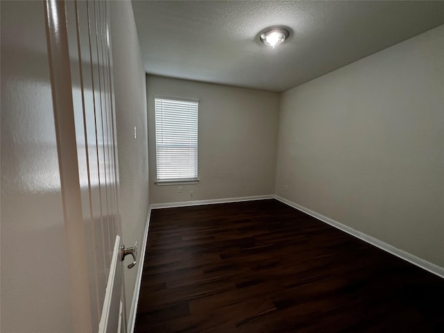 9105 Edenberry Ln, Fort Worth, TX 76179 - empty room with dark wood-style flooring and baseboards