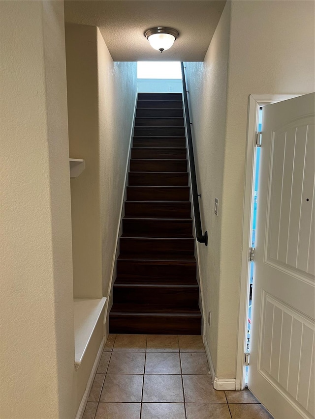 9105 Edenberry Ln, Fort Worth, TX 76179 - stairway with tile patterned floors and a textured wall