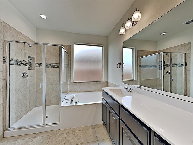 9105 Edenberry Ln, Fort Worth, TX 76179 - full bathroom featuring a stall shower, a bath, vanity, tile patterned floors, and recessed lighting