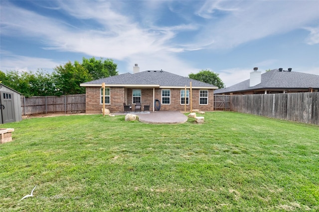 390 Sugarberry Ave, Abilene, TX 79602 - back of property with a patio area, a shed, an outdoor structure, brick siding, and a shingled roof