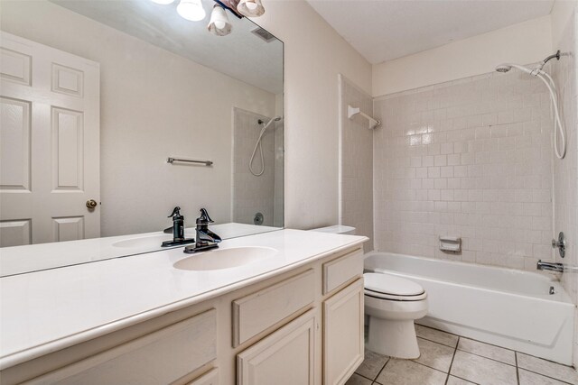 full bathroom with tile patterned floors, tub / shower combination, toilet, and vanity